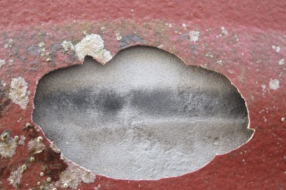 Burn marks visible behind coating